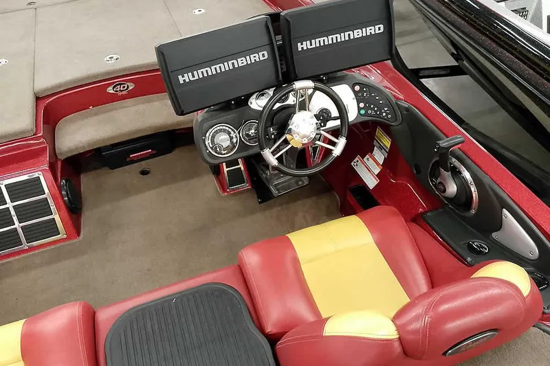 Slide: The Image of 2008 Ranger Z520 Comanche boat interior with Humminbird electronics and red-yellow seating. - 37