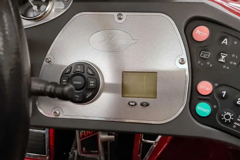 Slide: The Image of 2008 Ranger Z520 Comanche dashboard with control panel and display screen. - 38