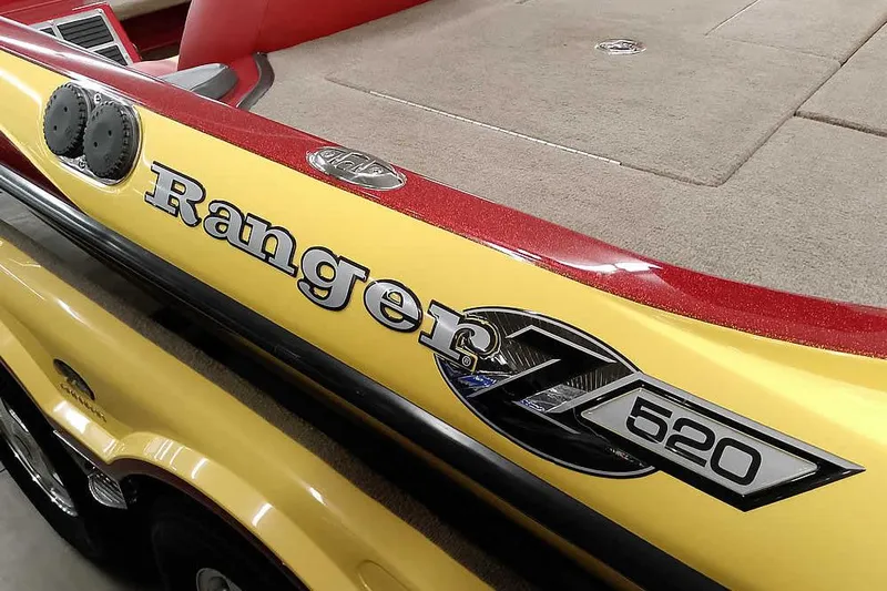 Slide: The Image of 2008 Ranger Z520 Comanche boat, yellow and red detailing, close-up view. - 4