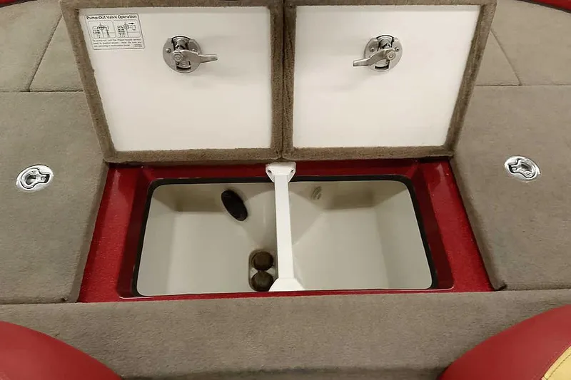 Slide: The Image of 2008 Ranger Z520 Comanche boat storage compartments with carpeted lids and secure latches. - 40