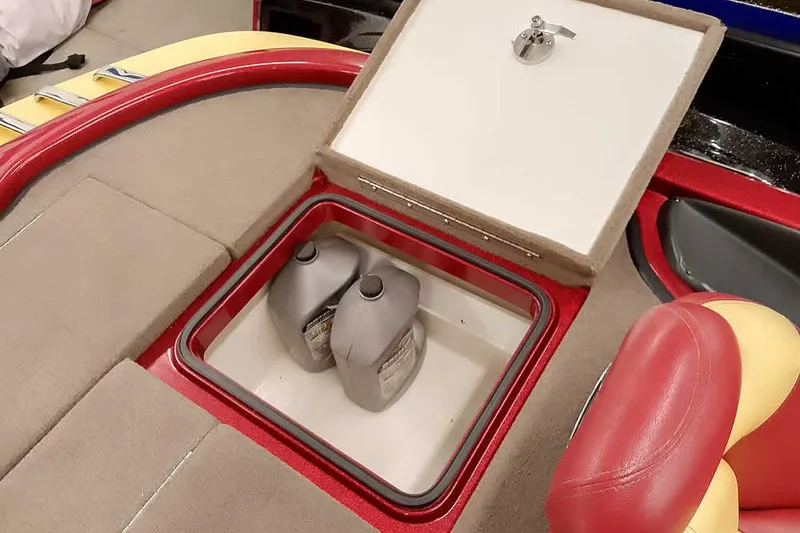 Slide: The Image of Storage compartment in 2008 Ranger Z520 Comanche boat with two oil containers. - 41