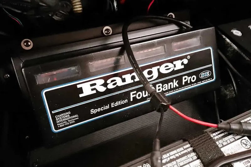 Slide: The Image of 2008 Ranger Z520 Comanche Four Bank Pro charger with cables connected. - 44