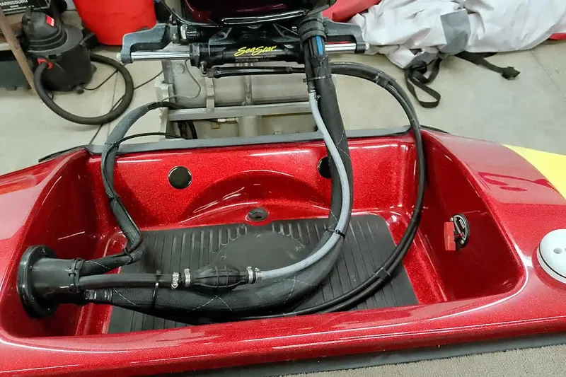 Slide: The Image of 2008 Ranger Z520 Comanche boat engine compartment with cables and hoses. - 45