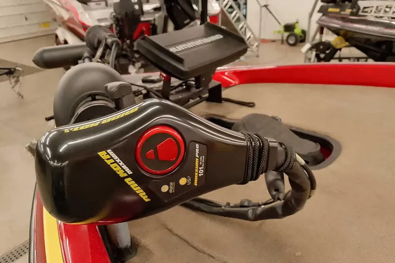 Slide: The Image of 2008 Ranger Z520 Comanche boat with Minn Kota trolling motor in a garage setting. - 9