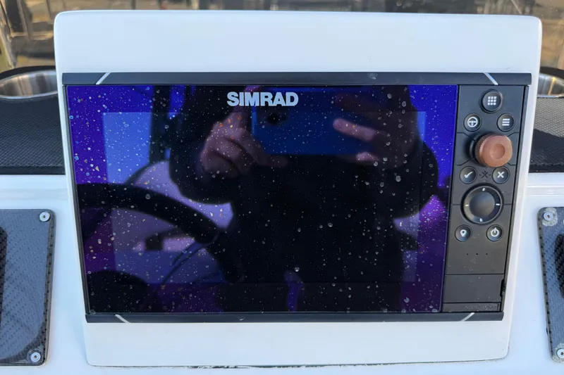 Slide: The Image of Simrad display on 2018 SCB Recon boat, showing water droplets and control buttons. - 11