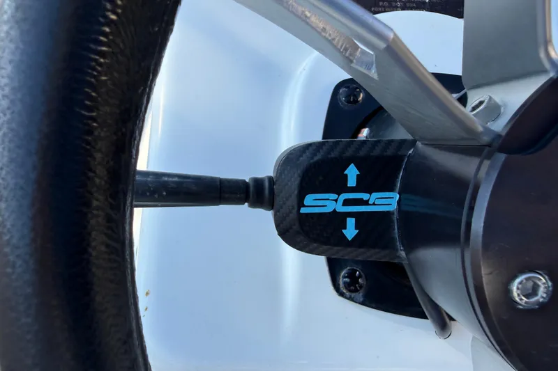 Slide: The Image of Steering wheel detail of 2018 SCB Recon boat with logo and arrows. - 13