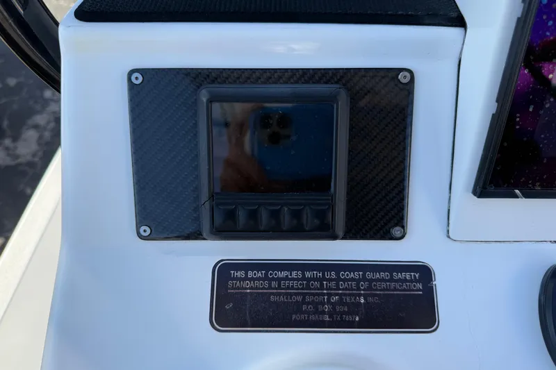 Slide: The Image of Control panel of 2018 SCB Recon boat with safety compliance plaque. - 14