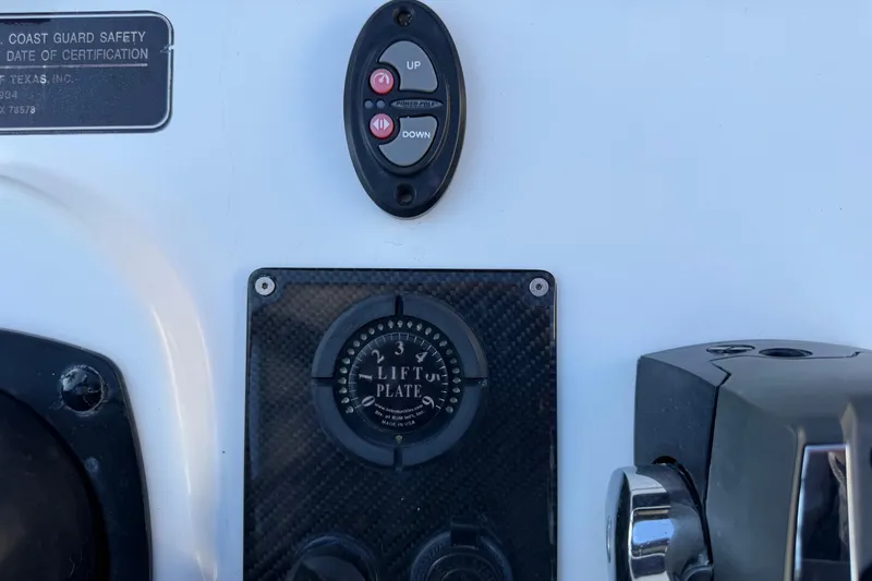 Slide: The Image of Control panel of 2018 SCB Recon boat with lift plate and adjustment buttons. - 17