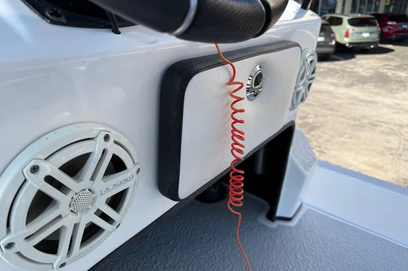 Slide: The Image of 2018 SCB Recon boat dashboard with JL Audio speaker and coiled red cord. - 21