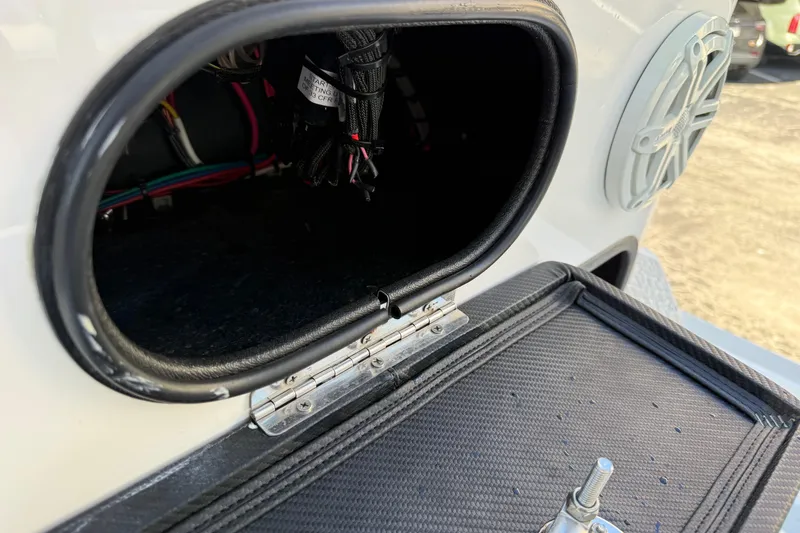 Slide: The Image of Open compartment of 2018 SCB Recon boat showing wiring and speaker. - 22