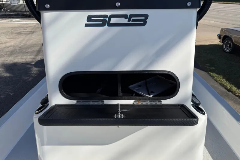 Slide: The Image of 2018 SCB Recon boat console with storage compartment open. - 24