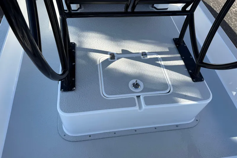 Slide: The Image of 2018 SCB Recon boat deck with storage compartment and black railings. - 31