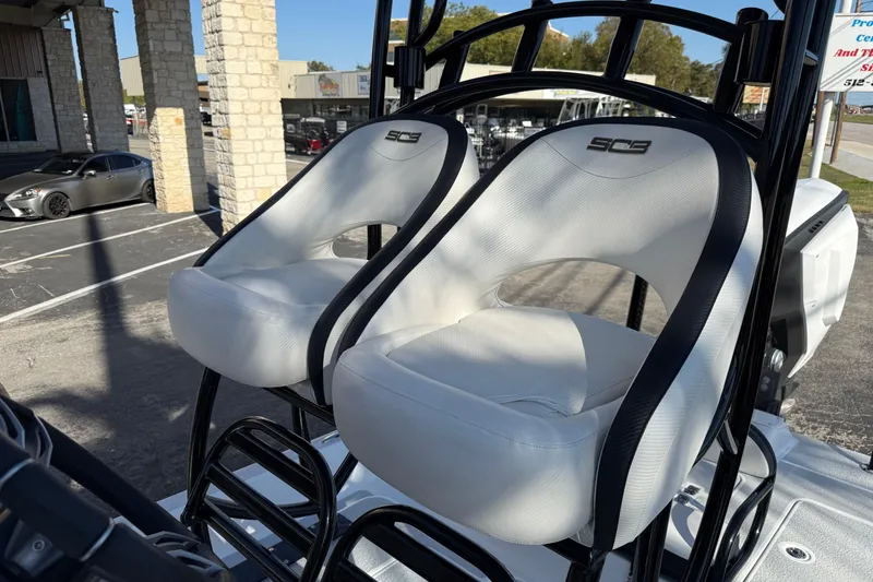 Slide: The Image of 2018 SCB Recon boat seats with black trim in outdoor setting. - 34
