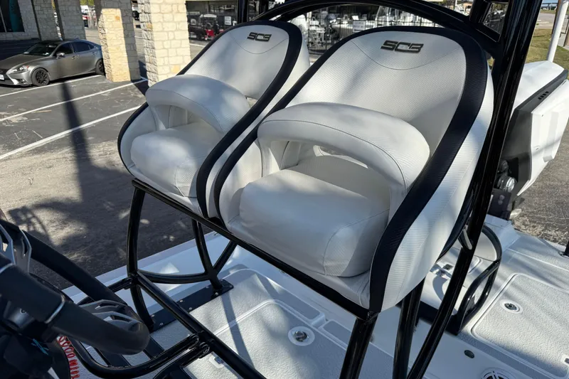 Slide: The Image of 2018 SCB Recon boat seats with sleek white design and black accents. - 35