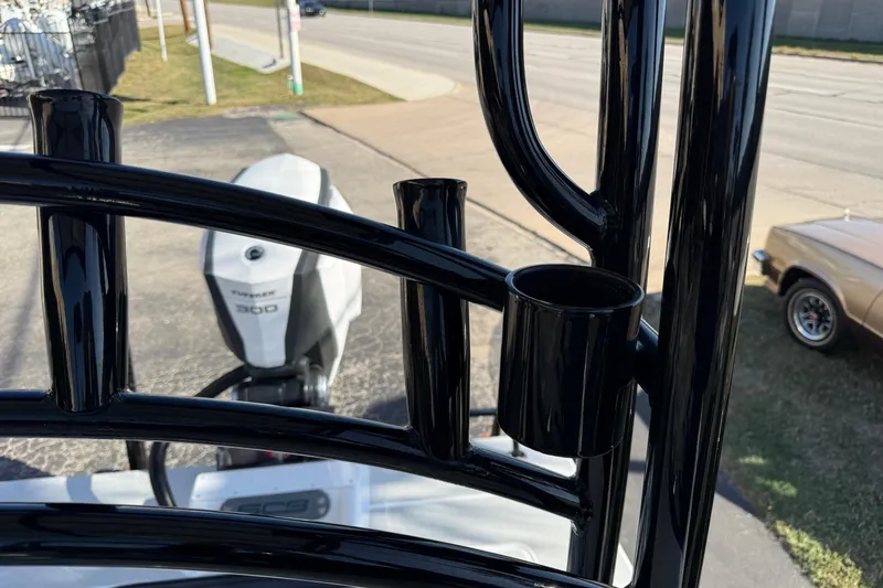 Slide: The Image of 2018 SCB Recon boat with black metal frame and powerful outboard motor. - 36