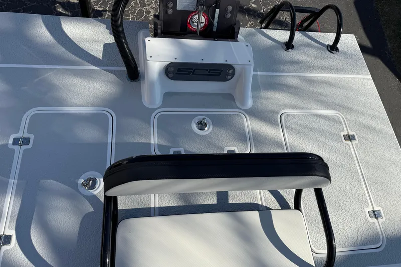 Slide: The Image of 2018 SCB Recon boat deck with seating and storage compartments. - 37