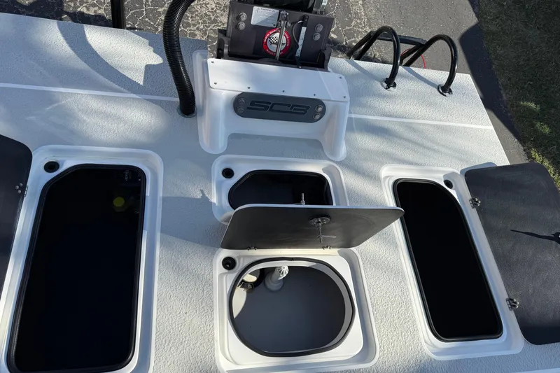 Slide: The Image of 2018 SCB Recon boat deck with open storage compartments and equipment. - 38