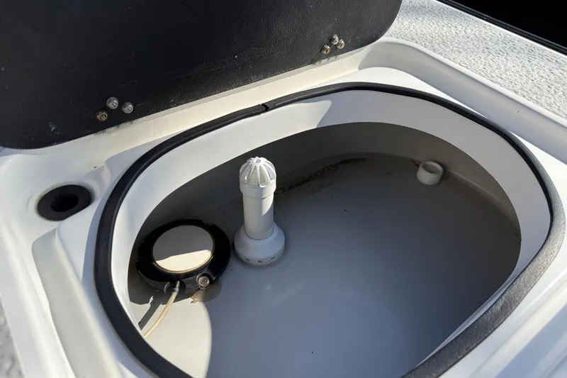 Slide: The Image of 2018 SCB Recon boat livewell with open lid and plumbing components. - 39
