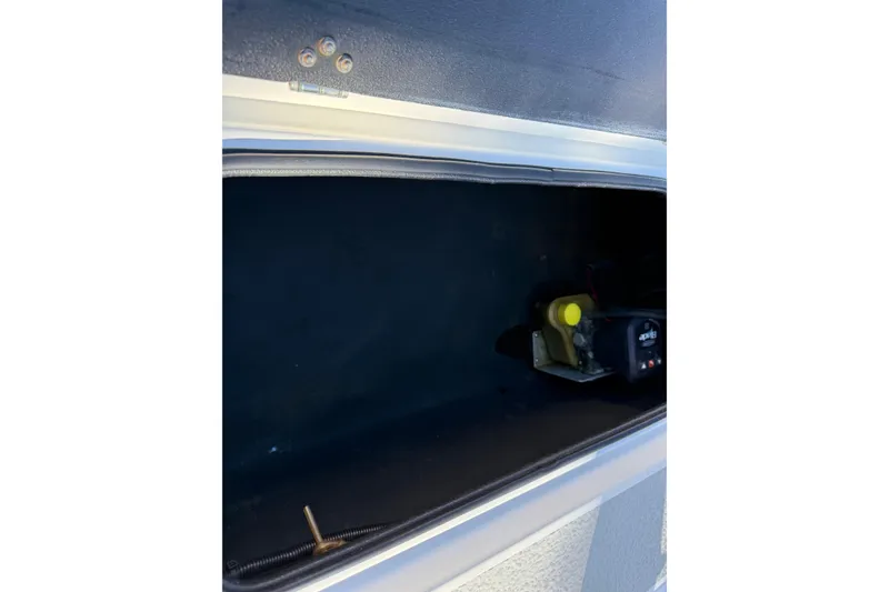Slide: The Image of Storage compartment of a 2018 SCB Recon boat, featuring interior equipment. - 41
