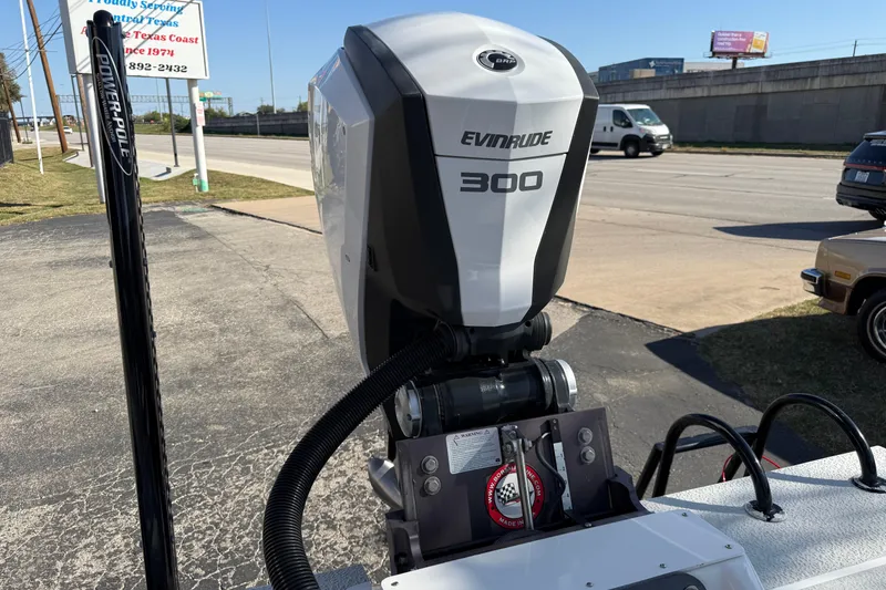 Slide: The Image of 2018 SCB Recon with Evinrude 300 outboard motor in a parking lot. - 8