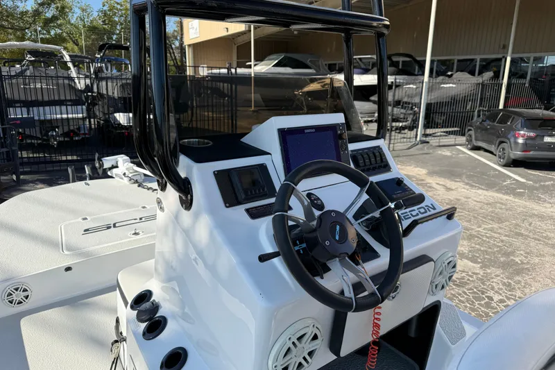 Slide: The Image of 2018 SCB Recon boat dashboard with steering wheel and navigation controls. - 9