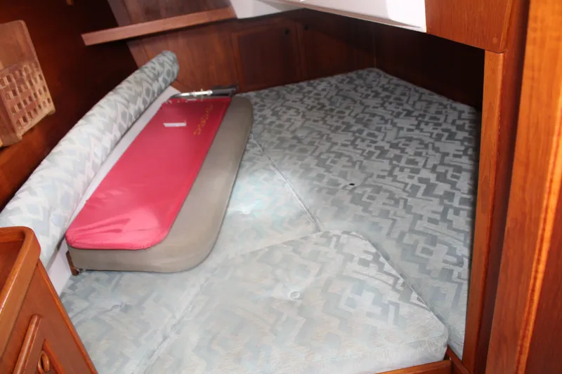 Slide: The Image of Cozy cabin interior of 1998 Nauticat 32 Pilothouse with patterned cushions. - 12