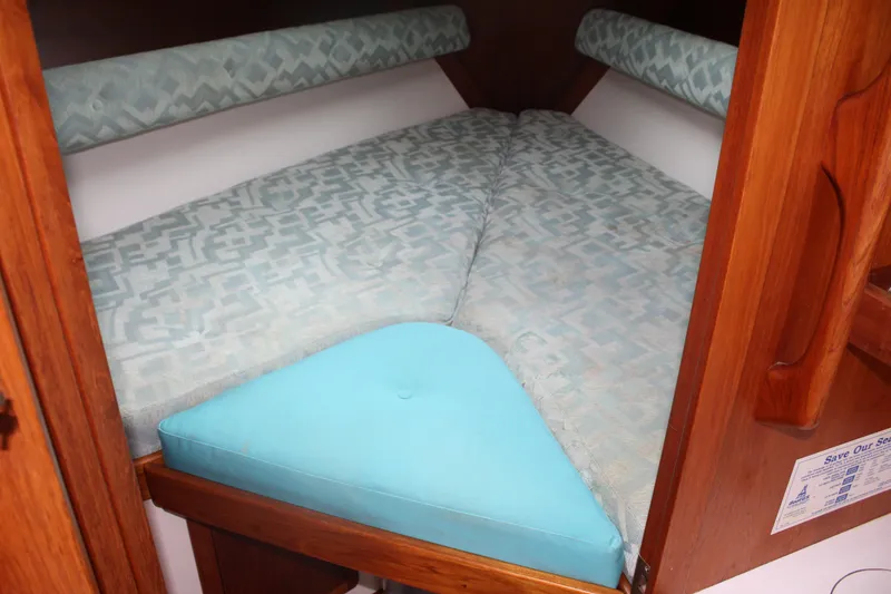 Slide: The Image of Cozy cabin bed in 1998 Nauticat 32 Pilothouse with patterned cushions. - 22