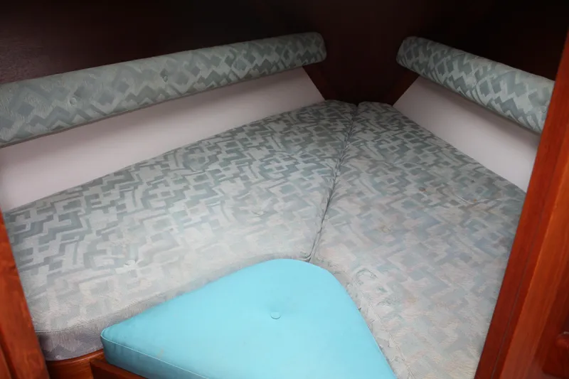 Slide: The Image of Cozy cabin interior of 1998 Nauticat 32 Pilothouse with patterned cushions. - 23