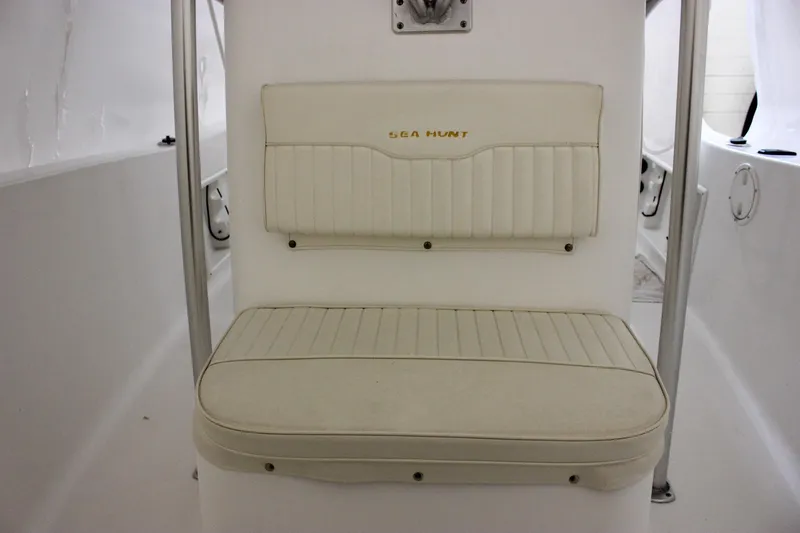 Slide: The Image of 2006 Sea Hunt Triton 207 boat seat with white upholstery and logo. - 15
