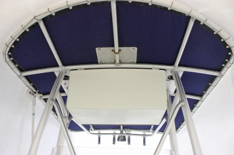 Slide: The Image of 2006 Sea Hunt Triton 207 T-top with blue canvas and metal frame. - 16