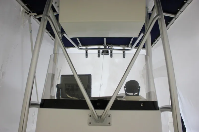 Slide: The Image of 2006 Sea Hunt Triton 207 boat console with canopy and navigation equipment. - 17