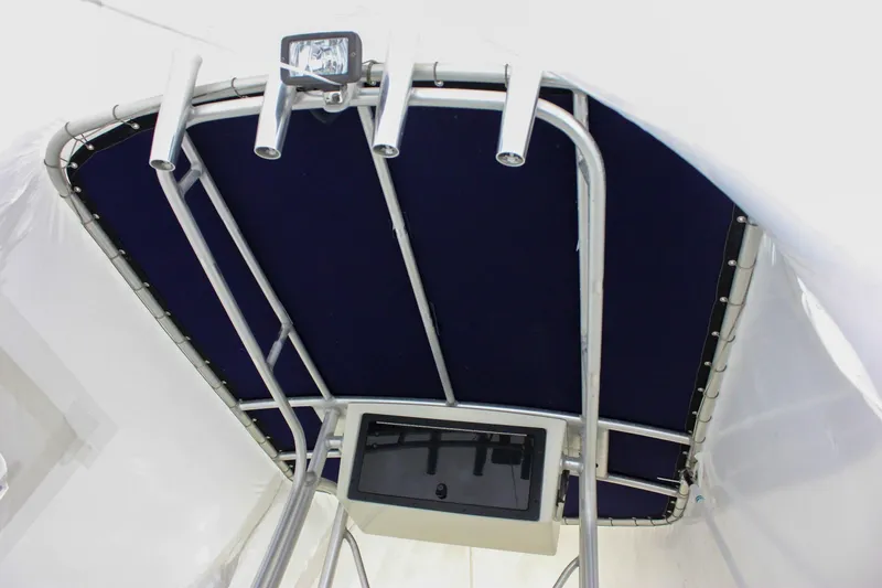 Slide: The Image of 2006 Sea Hunt Triton 207 T-top with mounted lights and electronics. - 19