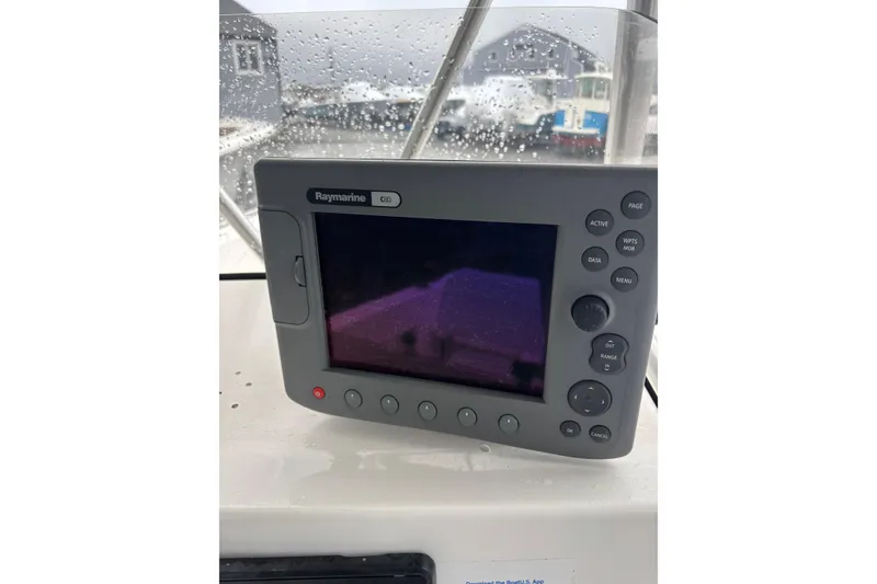 Slide: The Image of Raymarine C80 display on 2006 Sea Hunt Triton 207 boat, with raindrops on window. - 24