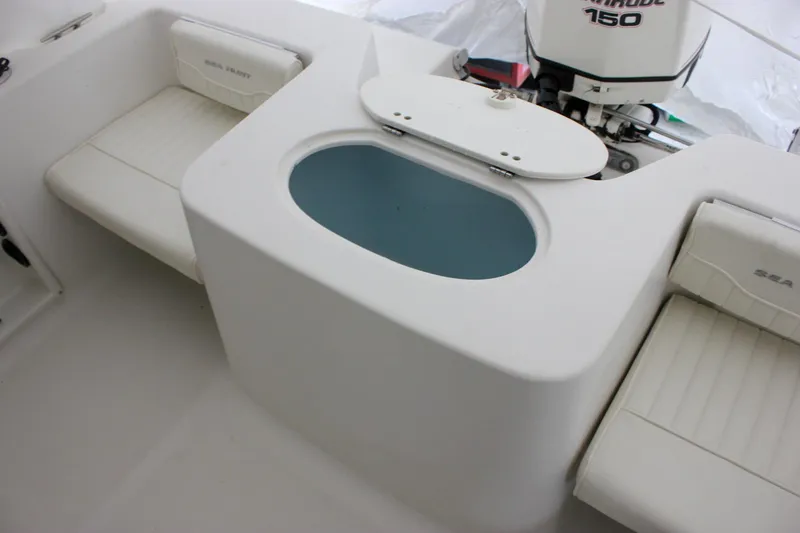 Slide: The Image of 2006 Sea Hunt Triton 207 boat interior with seating and livewell. - 7