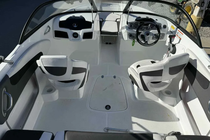 Slide: The Image of Interior of 2021 Tahoe 550 TS boat with modern seating and steering console. - 9