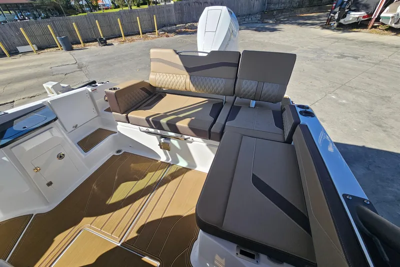 Slide: The Image of 2026 Monterey Elite 27 OB boat interior with luxurious seating and modern design. - 11