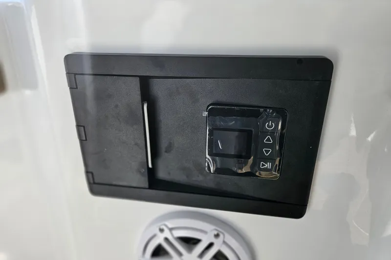 Slide: The Image of Control panel on 2026 Monterey Elite 27 OB boat, featuring buttons and speaker. - 15