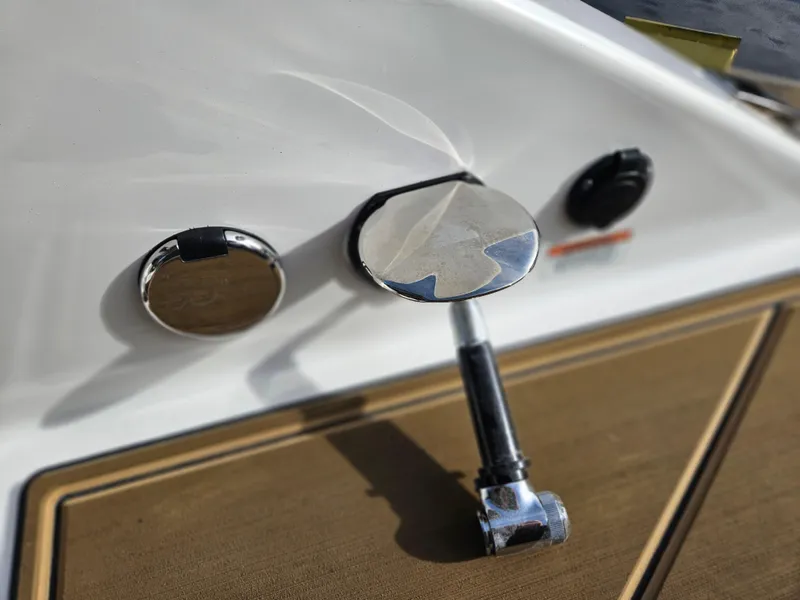 Slide: The Image of 2025 Monterey Elite 27 OB boat dashboard with chrome and wood accents. - 20