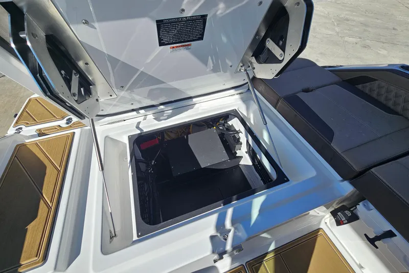 Slide: The Image of Open engine compartment of 2026 Monterey Elite 27 OB boat, showcasing interior details. - 23