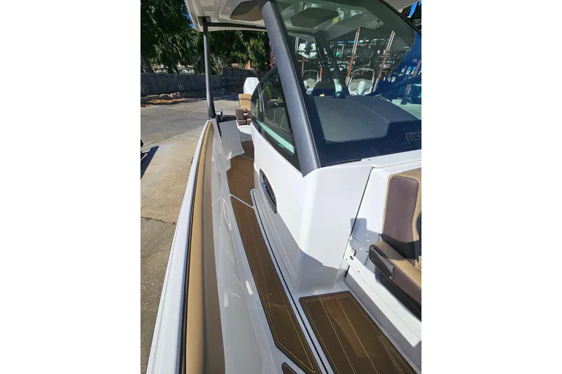 Slide: The Image of 2026 Monterey Elite 27 OB boat deck with sleek design and modern features. - 35
