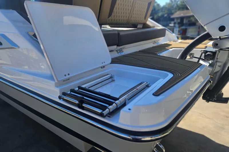 Slide: The Image of 2026 Monterey Elite 27 OB boat with sleek deck design and modern features. - 4