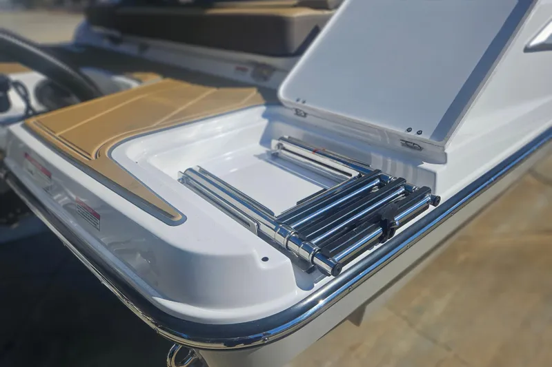 Slide: The Image of 2026 Monterey Elite 27 OB boat with stainless steel ladder and sleek deck design. - 7