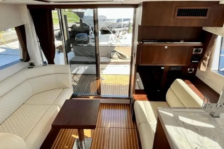 Slide: The Image of Luxurious interior of 2017 Galeon 380 Fly yacht with elegant seating and wooden finishes. - 10
