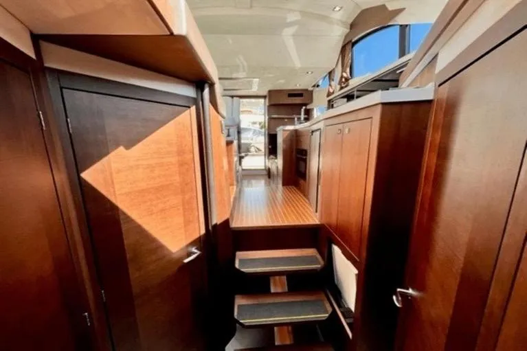 Slide: The Image of Luxurious interior of 2017 Galeon 380 Fly yacht with wooden cabinetry and modern design. - 15