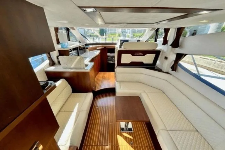 Slide: The Image of Luxurious interior of 2017 Galeon 380 Fly yacht with elegant seating and wooden flooring. - 6