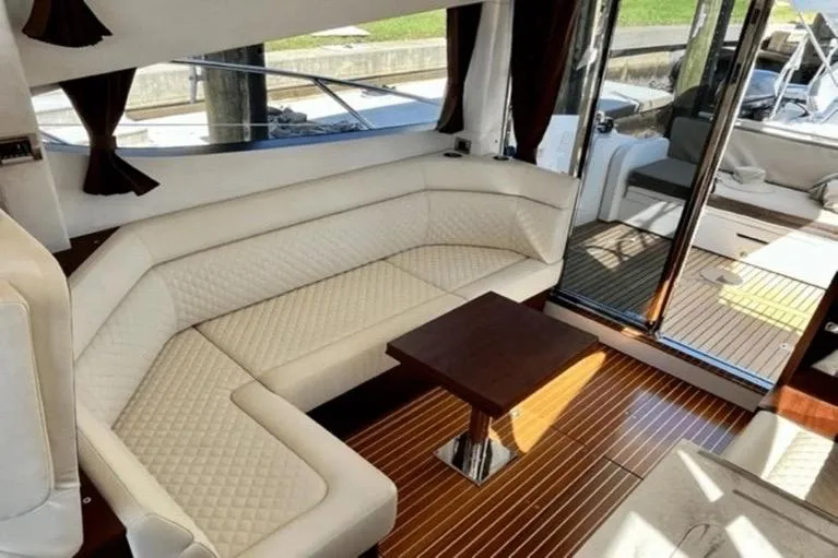 Slide: The Image of Luxurious interior of 2017 Galeon 380 Fly yacht with elegant seating and wooden flooring. - 7
