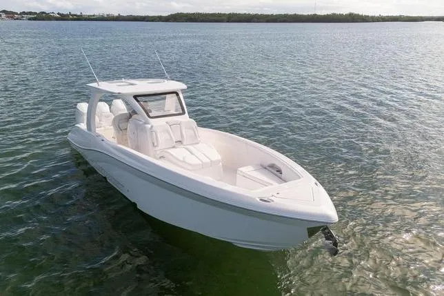 Slide: The Image of 2025 Deep Impact 369 Sport boat on calm water, showcasing sleek design and modern features. - 2