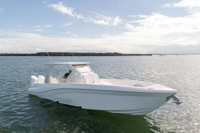 Slide: The Image of 2025 Deep Impact 369 Sport boat on calm water under a clear sky. - 3