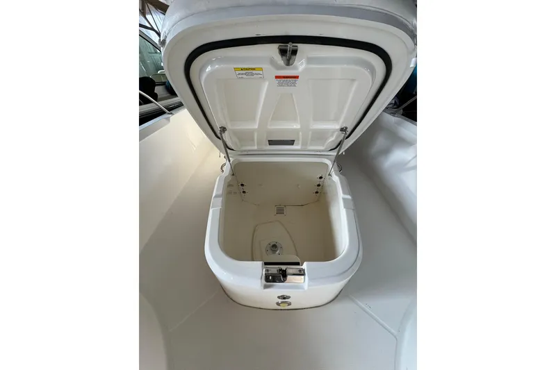 Slide: The Image of Open storage compartment on 2014 Boston Whaler 270 Dauntless boat. - 13