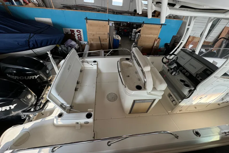 Slide: The Image of 2014 Boston Whaler 270 Dauntless boat interior with Mercury engines and Garmin navigation. - 8